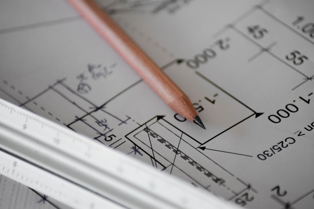 Engineer reviewing technical drawings