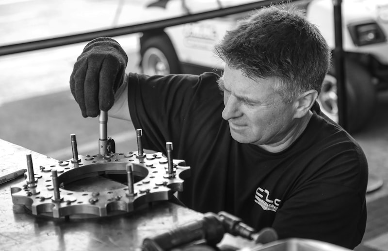 Technician servicing equipment with tools